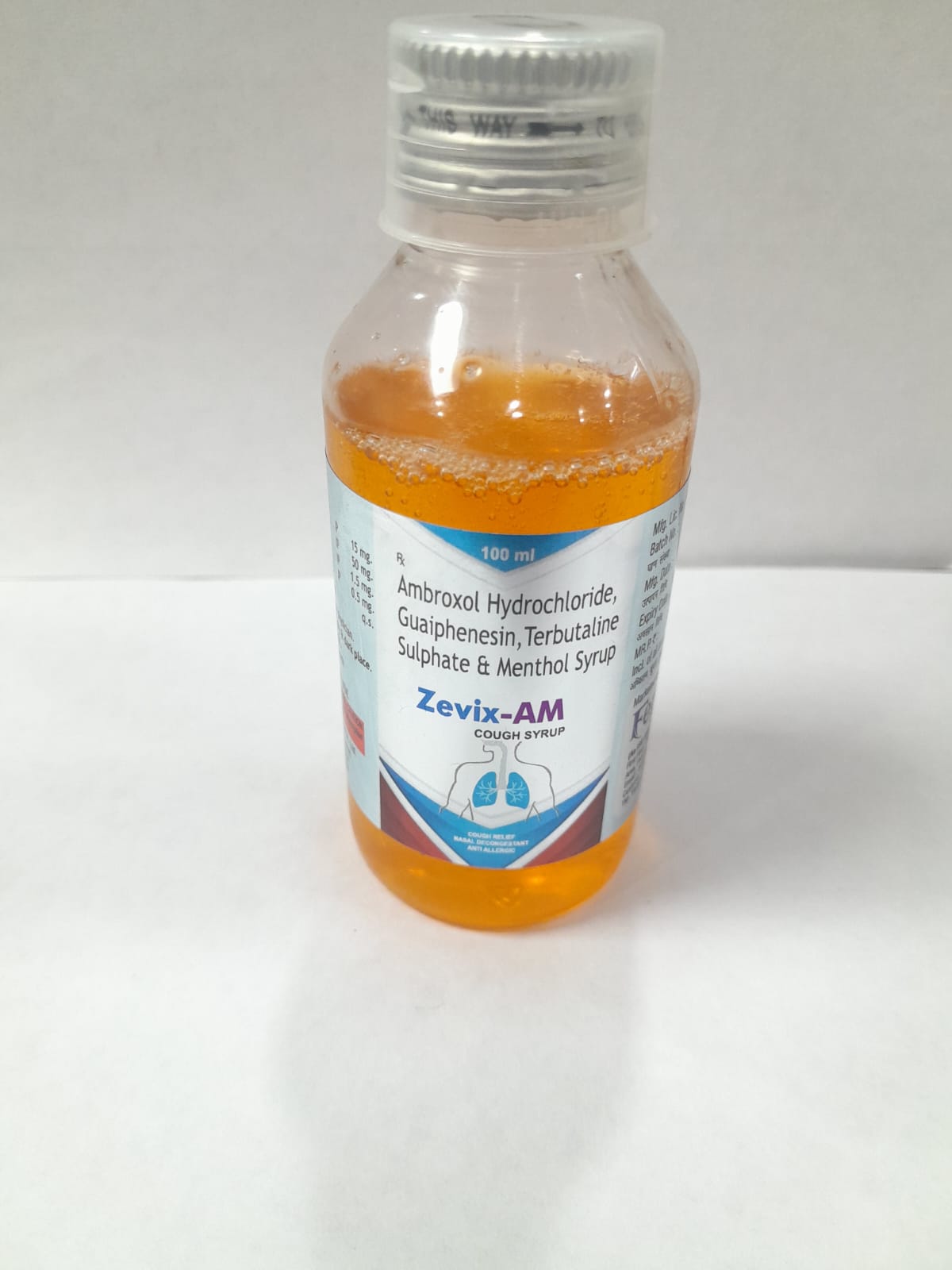 Product Name: ZEVIX AM Syrup, Compositions of ZEVIX AM Syrup are AMBROXOL 15MG, GUAIPHENESIN 50MG, TERBUTALINE 1.5MG, MENTHOL 0.5MG - Feravix Lifesciences